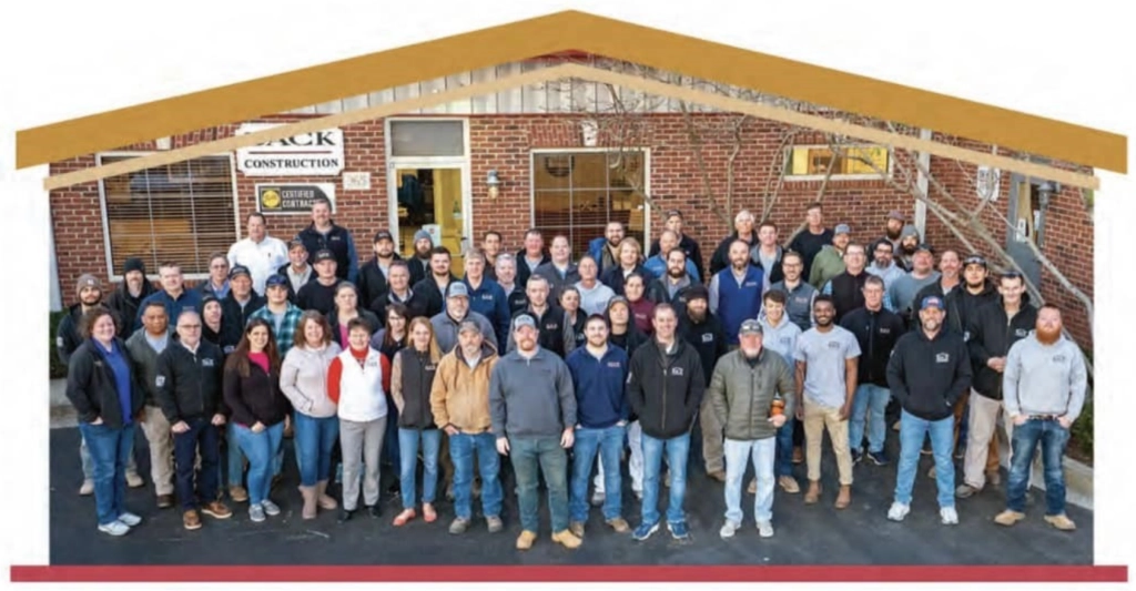 The BACK Construction team in Lexington, KY, standing together in front of their office, representing expert home remodeling, roofing, and general contracting services.