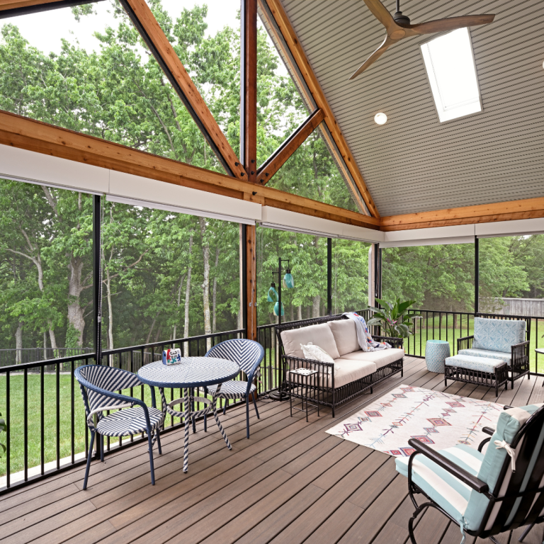 Screened porch with vaulted ceiling and natural wood beams