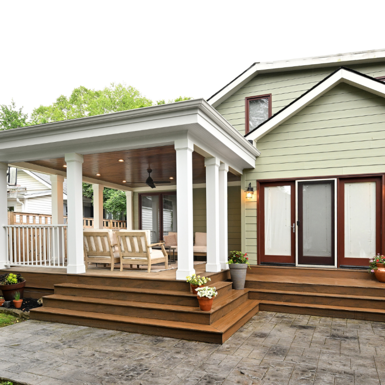 Backyard deck with stamped concrete and covered sitting area